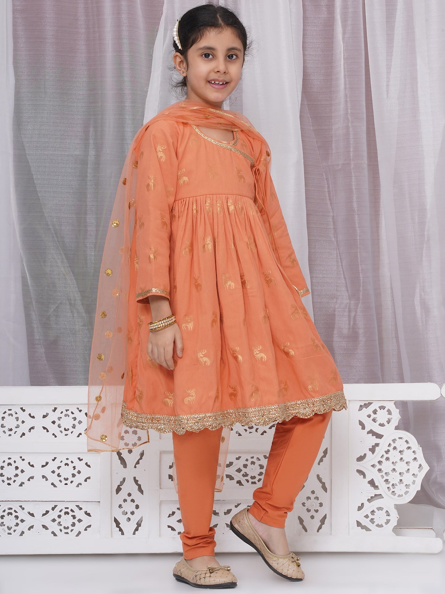 Girls festive dull orange Angrakha -pajami suit