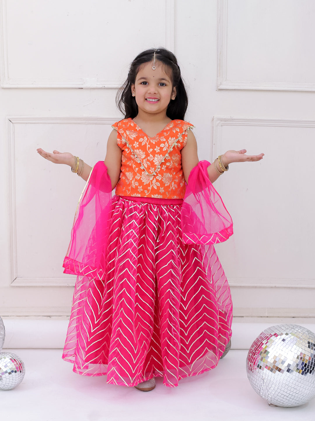Girls Banarasi top with zigzag pattern net lehnga set